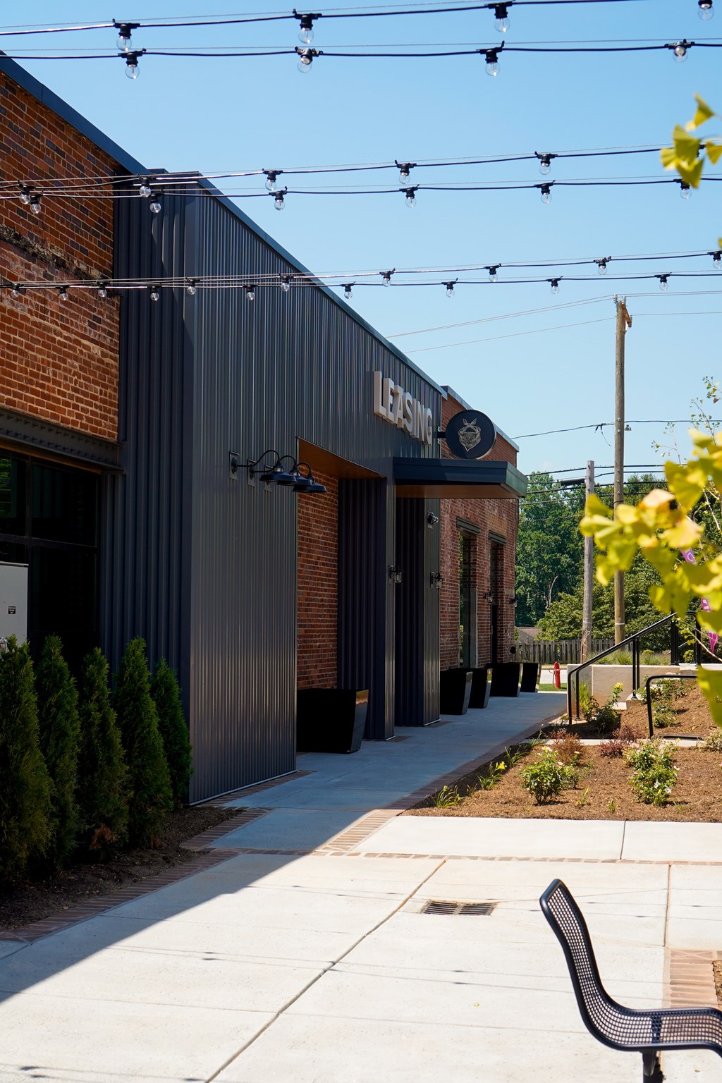 A black building with a sign that says "LEMON" on it.