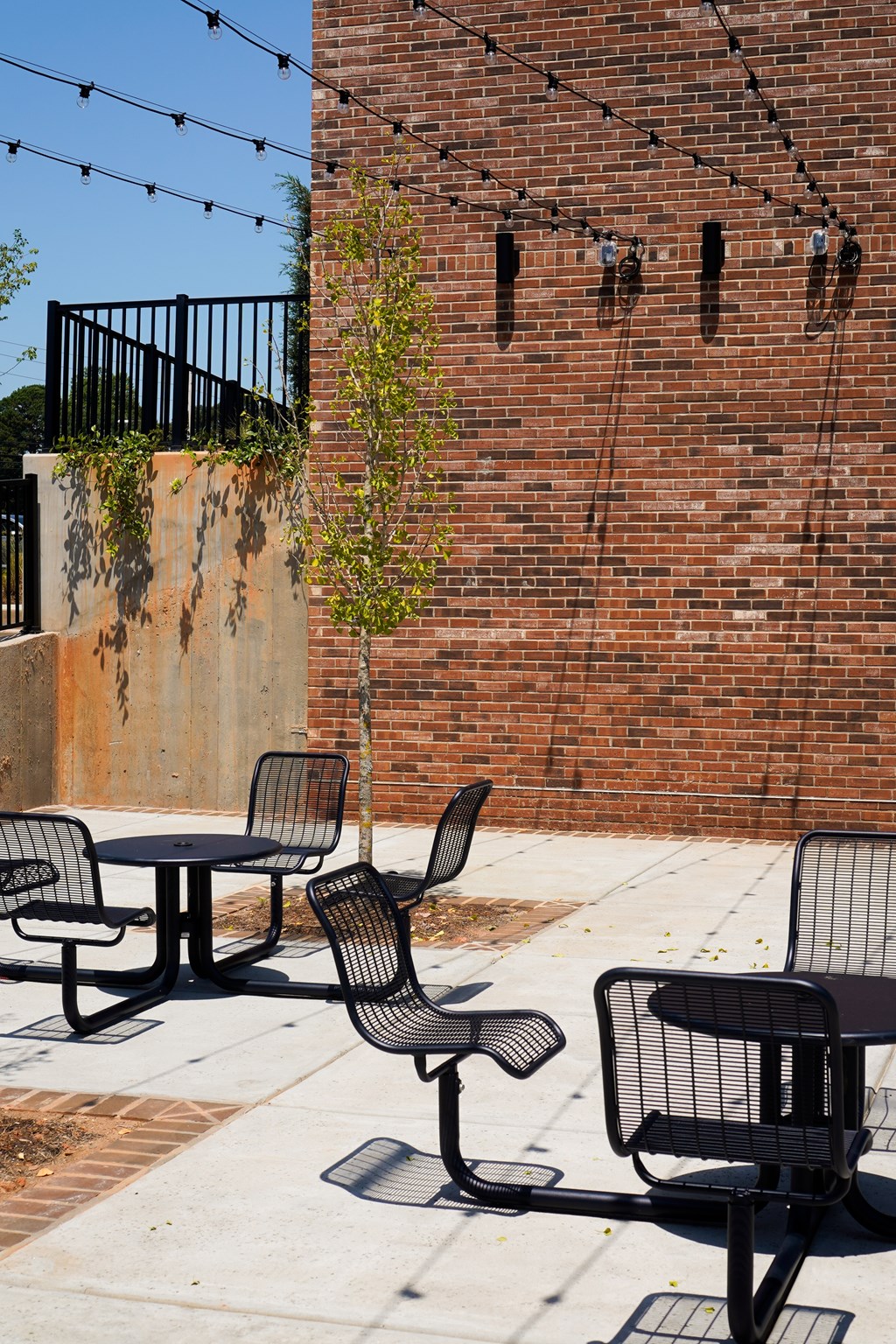 A patio with a table and chairs.