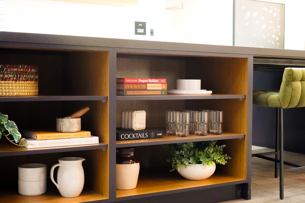 A shelf with a sign that says cocktails on it.