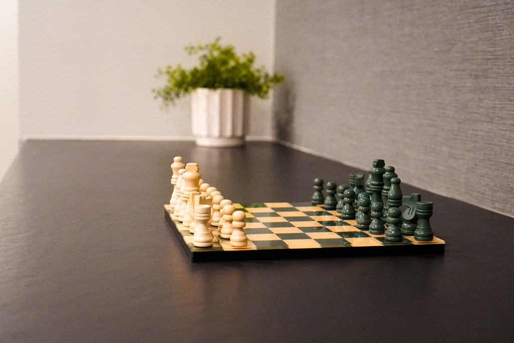 A chessboard with pieces in the middle of a game.