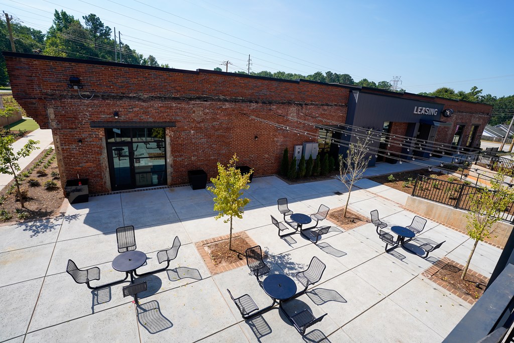 A leasing office is located in a brick building.