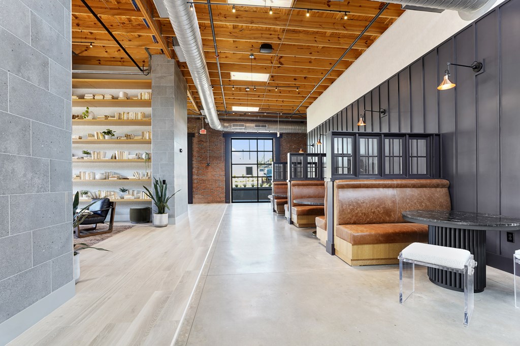 A long hallway with a bench on the right side.