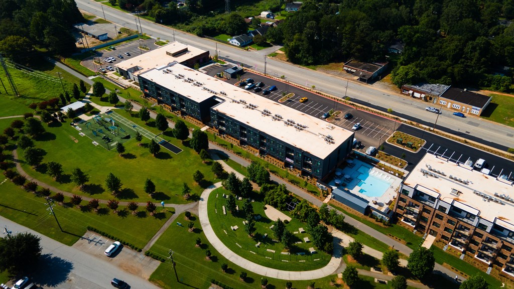A large building with a parking lot in front of it.