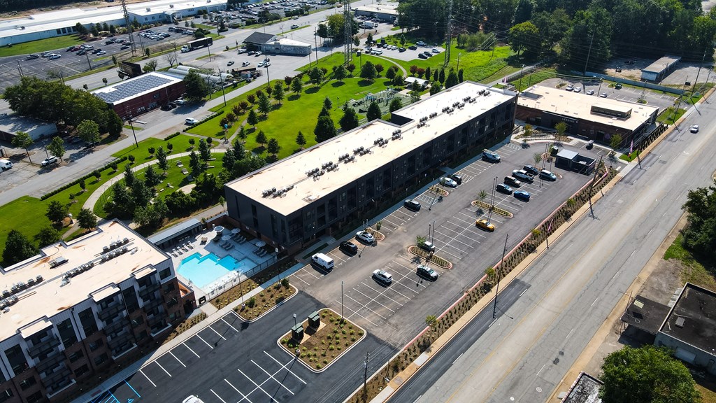 A parking lot is in front of a large building.