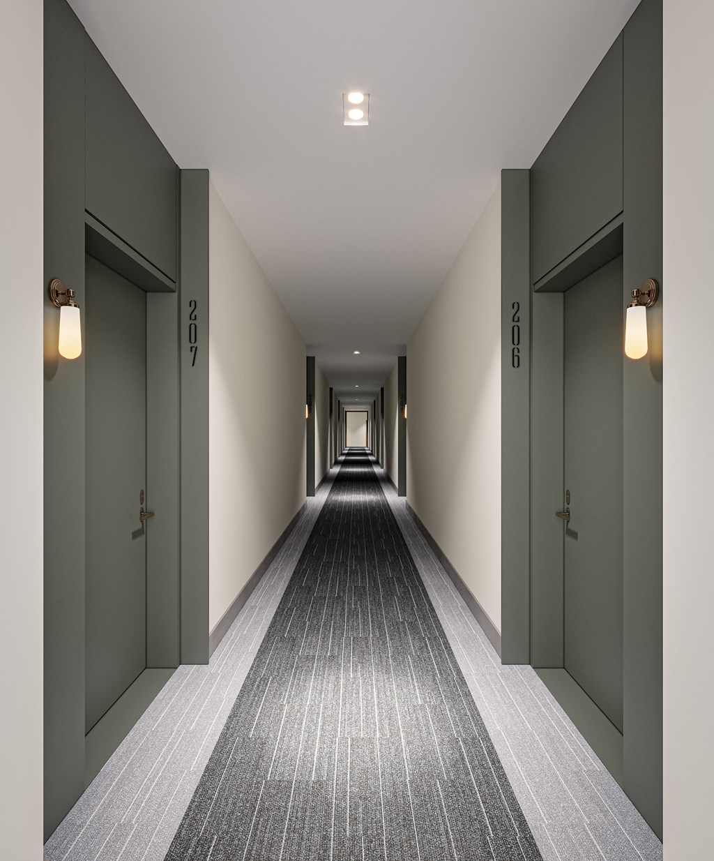 a corridor with green doors and a carpeted floor