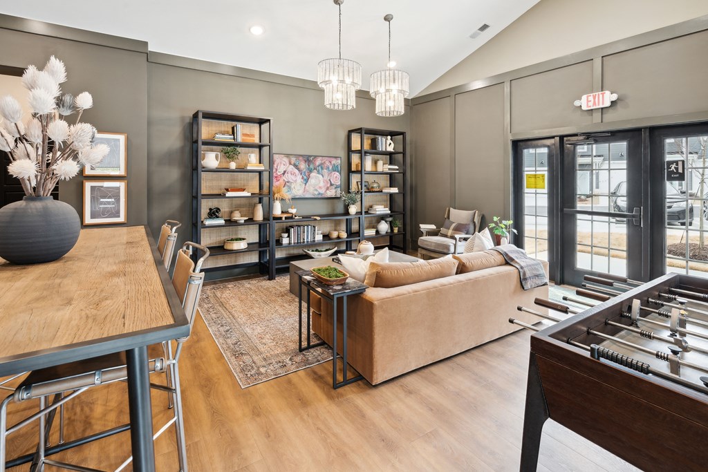 a living room with a piano and a dining table