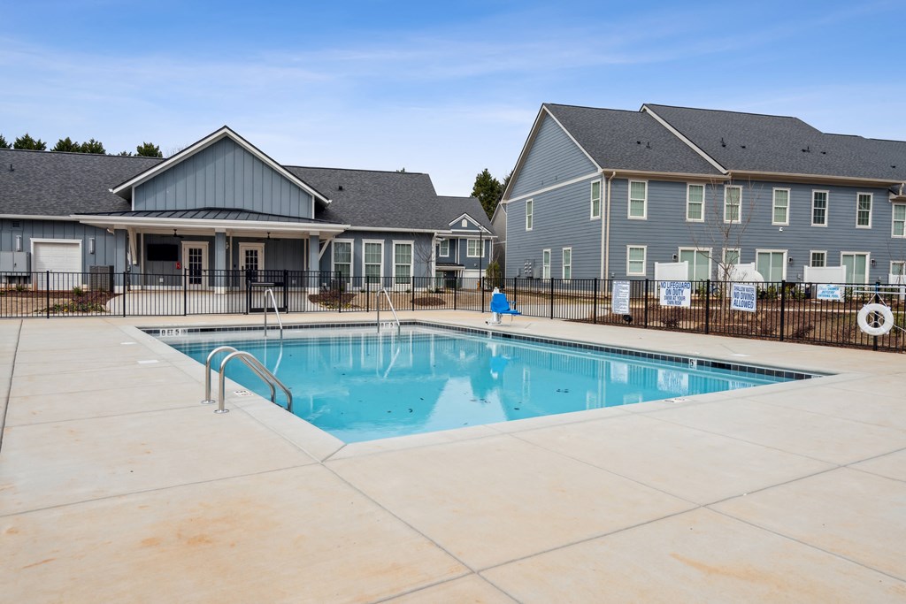our apartments have a swimming pool with our apartment buildings in the background