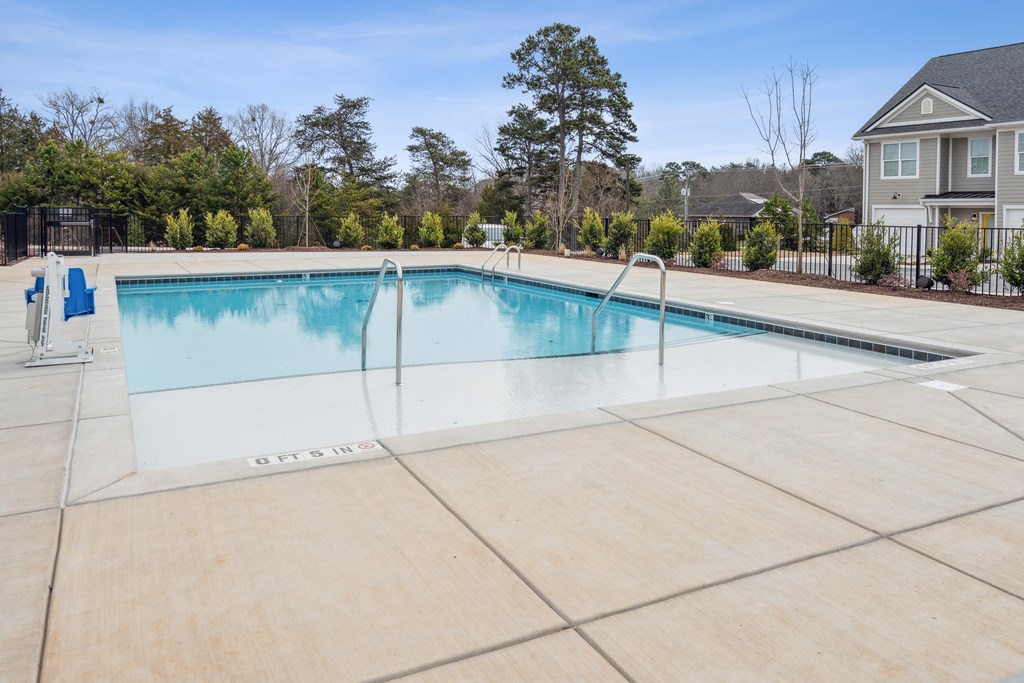 the swimming pool at our crossings apartments with a pool