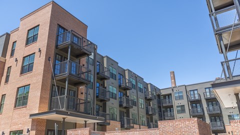 a view of the apartment buildings from the balcony