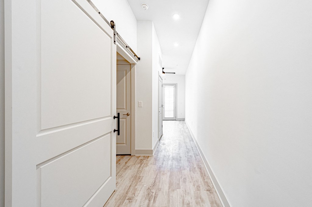 a bedroom with a medium sized bed and a closet with a sliding door