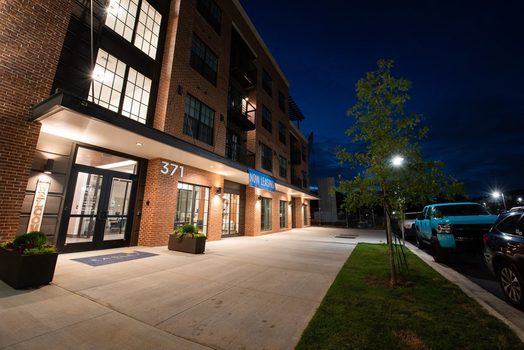 the building where the hotel is located is lit up at night