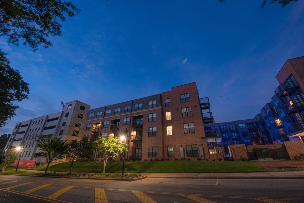 a building on the side of a street at night