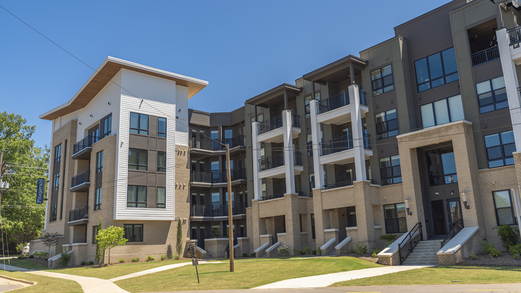 a large apartment building with a grassy area in front of it at The Fitzgerald, Spartanburg