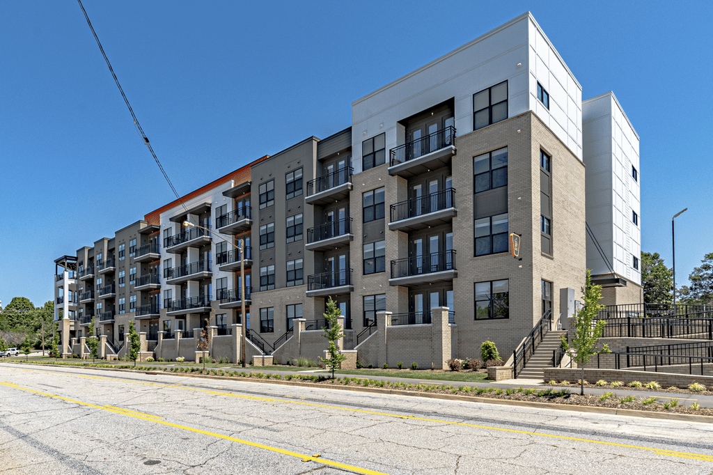 a rendering of a large apartment building on a city street at The Fitzgerald, South Carolina, 29302