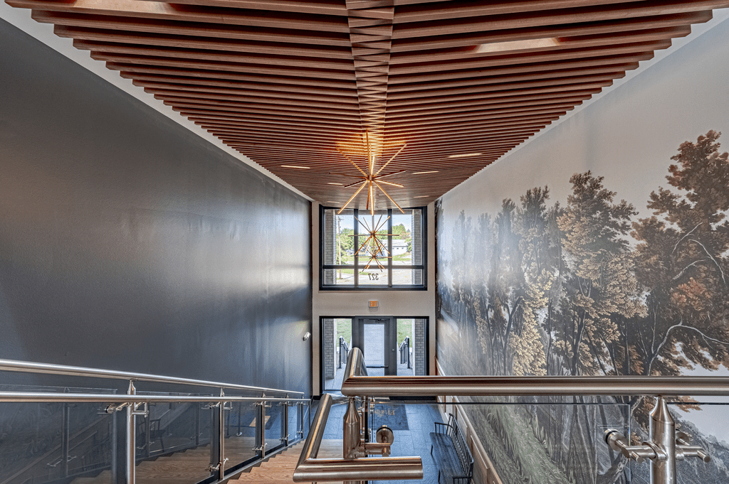 a view of the stairwell with a large mural on the wall at The Fitzgerald, Spartanburg, 29302