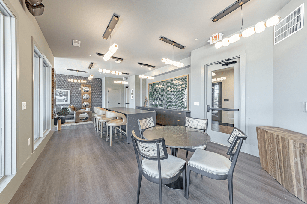 a resident clubhouse with tables and chairs at The Fitzgerald, Spartanburg, SC, 29302