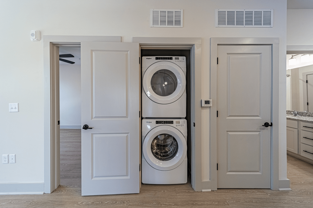 a front load washer and dryer are concealed by two doors at The Fitzgerald, South Carolina