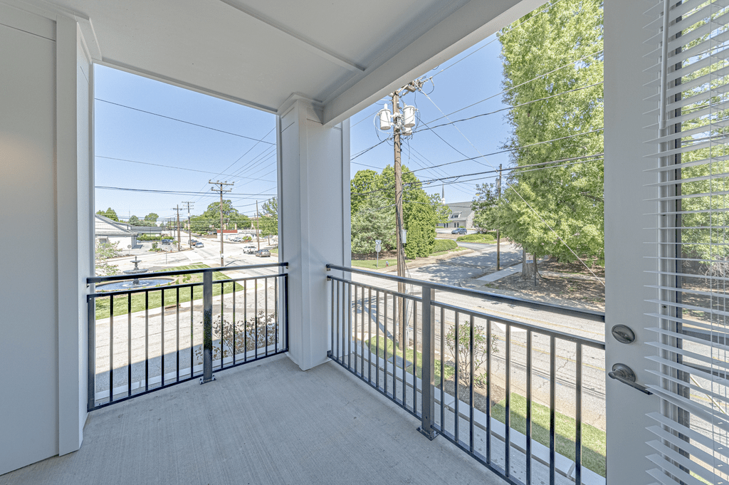 a large balcony with a view of the street at The Fitzgerald, Spartanburg, SC
