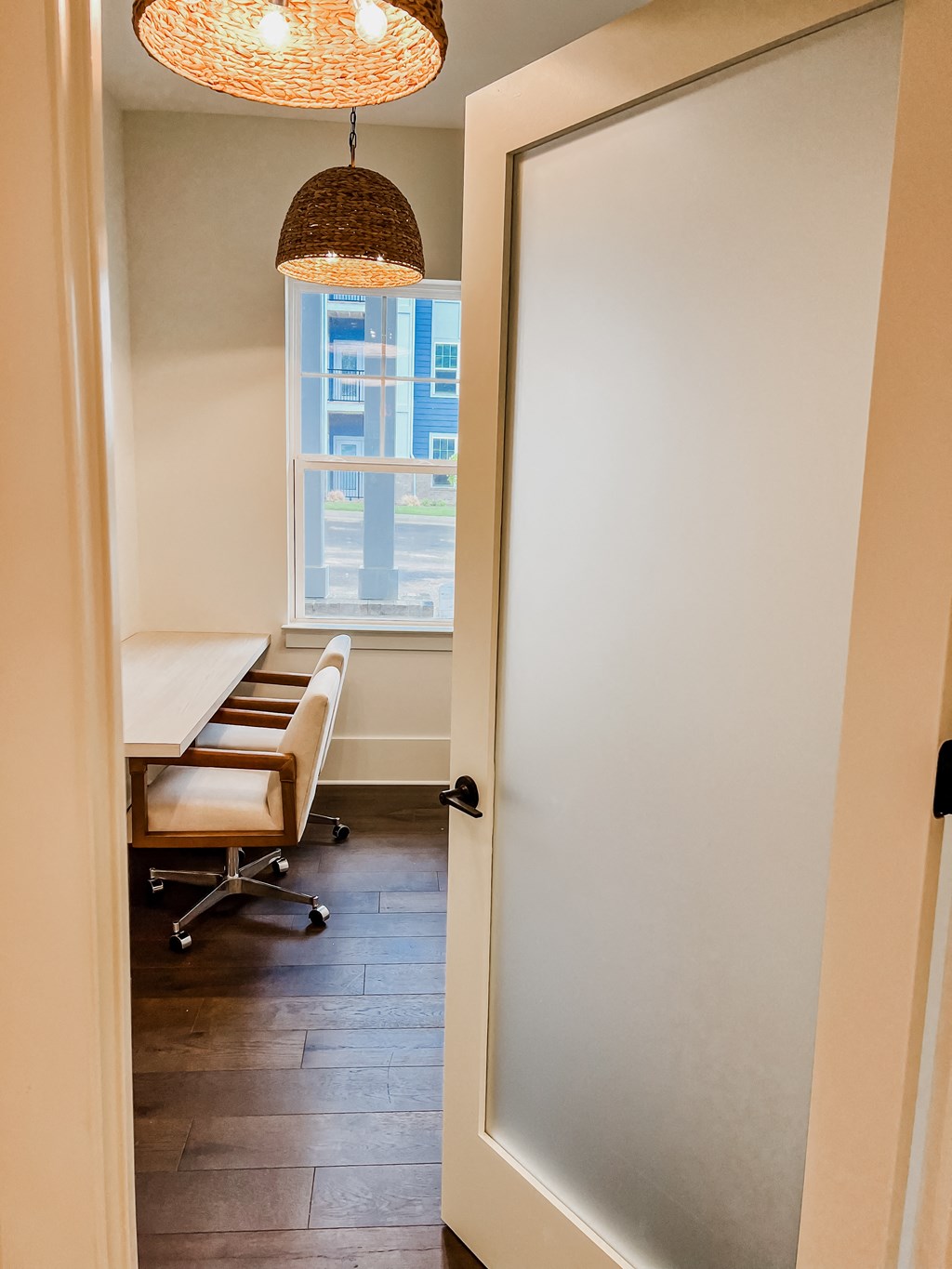 a room with a table and chairs and a door to a conference room at Hamilton Reserve, Greensboro, NC