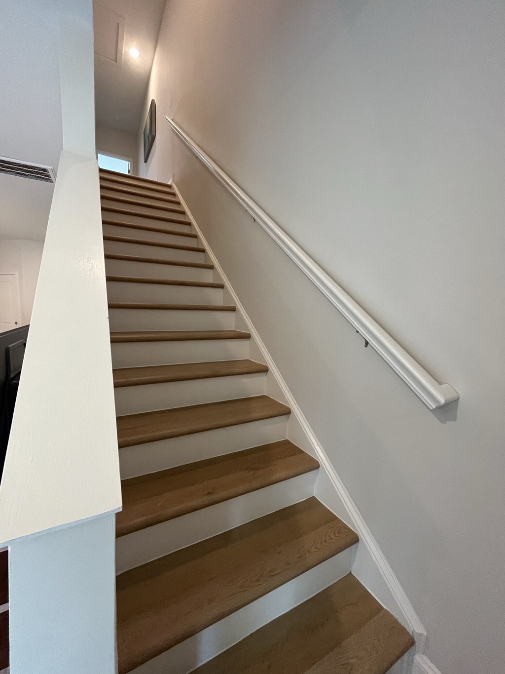a view from the bottom of the stairs looking up at Landon Green Artisan Cottages Apartments, Hickory, 28601
