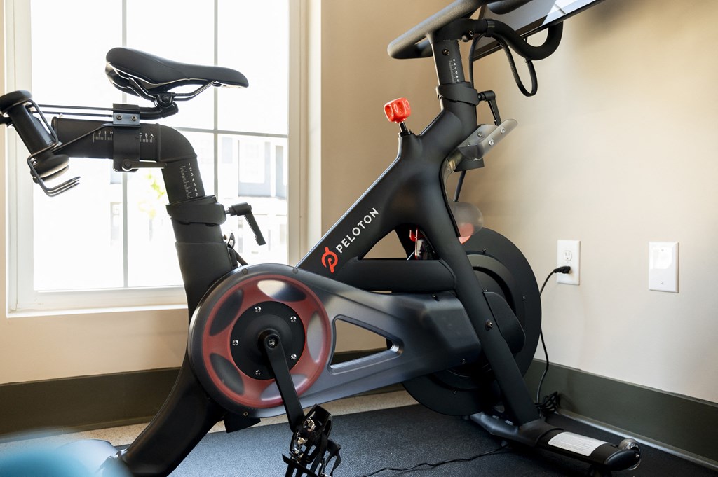 an exercise bike in a gym at Landon Green Artisan Cottages Apartments, Hickory, North Carolina