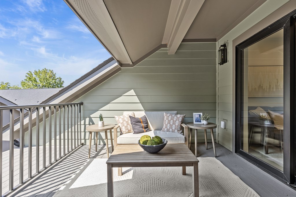 A patio with a table and chairs is shown.