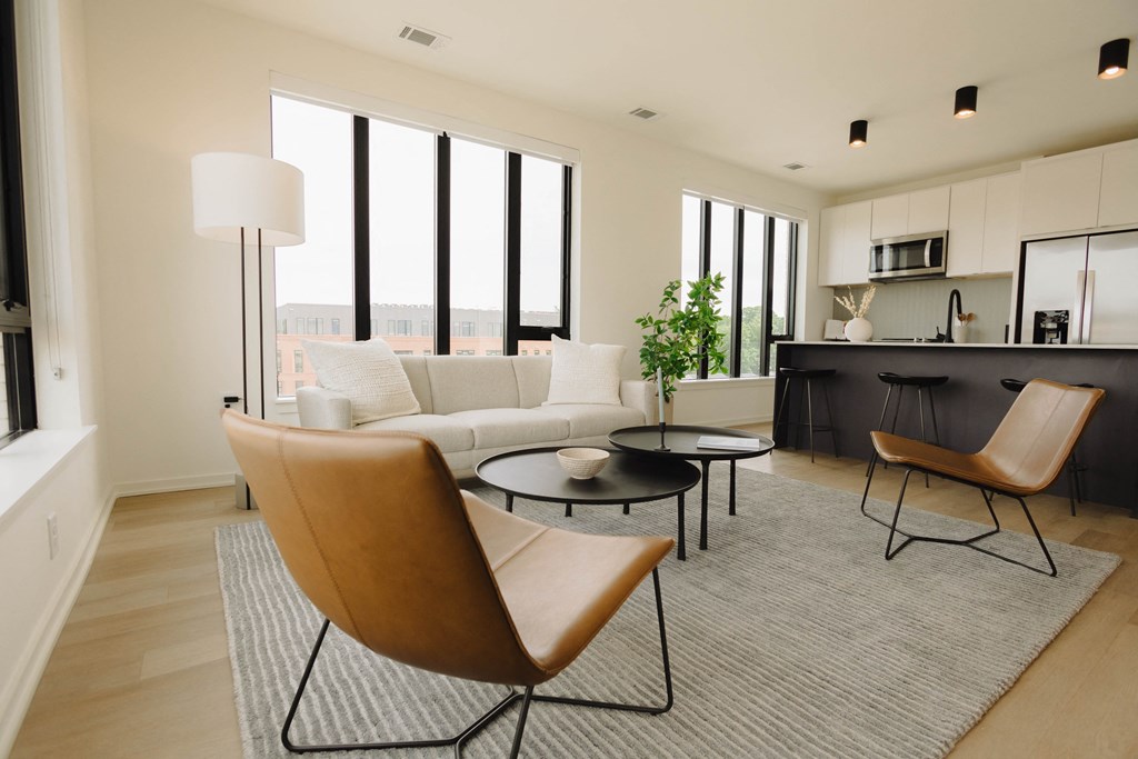 a living room with a white couch and a table