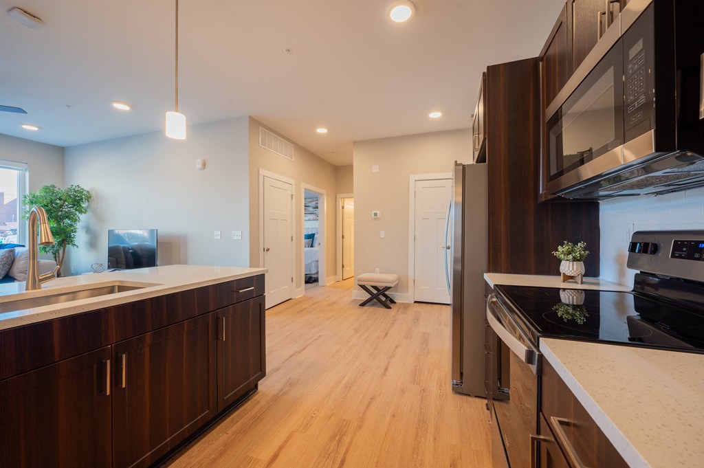 a kitchen with a stove and a sink and a refrigerator at Park View Greer, South Carolina
