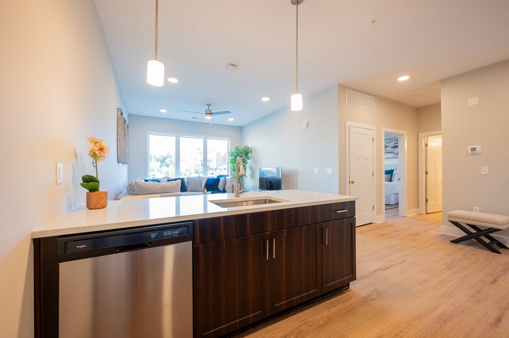 a kitchen with an island and a living room at Park View Greer, Greer
