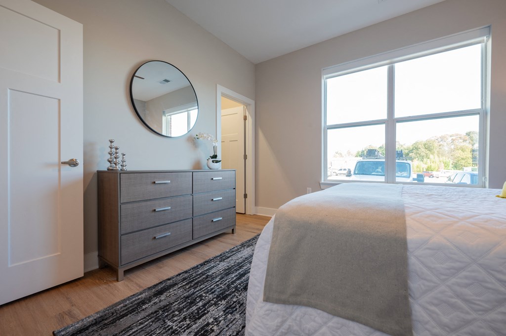 a bedroom with a bed and a dresser and a window at Park View Greer, Greer, South Carolina
