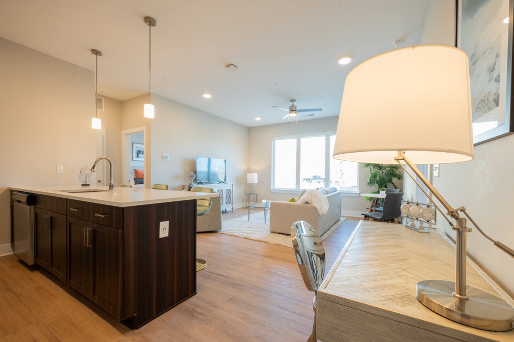 a kitchen with an island and a living room with a couch at Park View Greer, Greer, SC, 29365