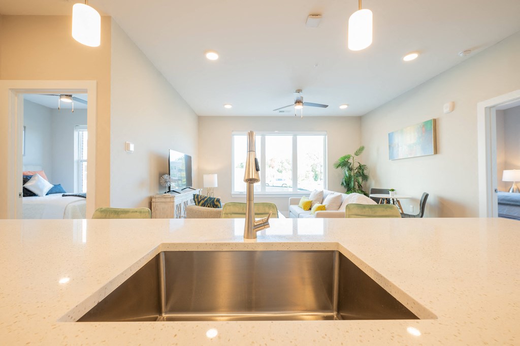 a kitchen with a sink and a view of a living room at Park View Greer, South Carolina