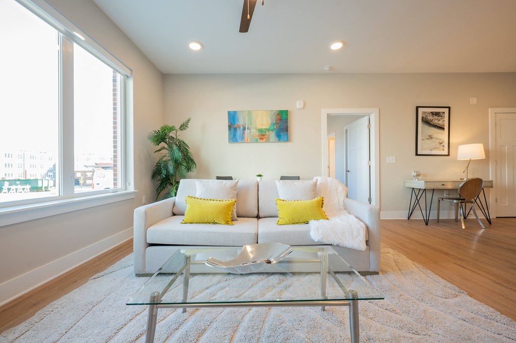 a living room with a couch and a glass coffee table at Park View Greer, Greer, South Carolina