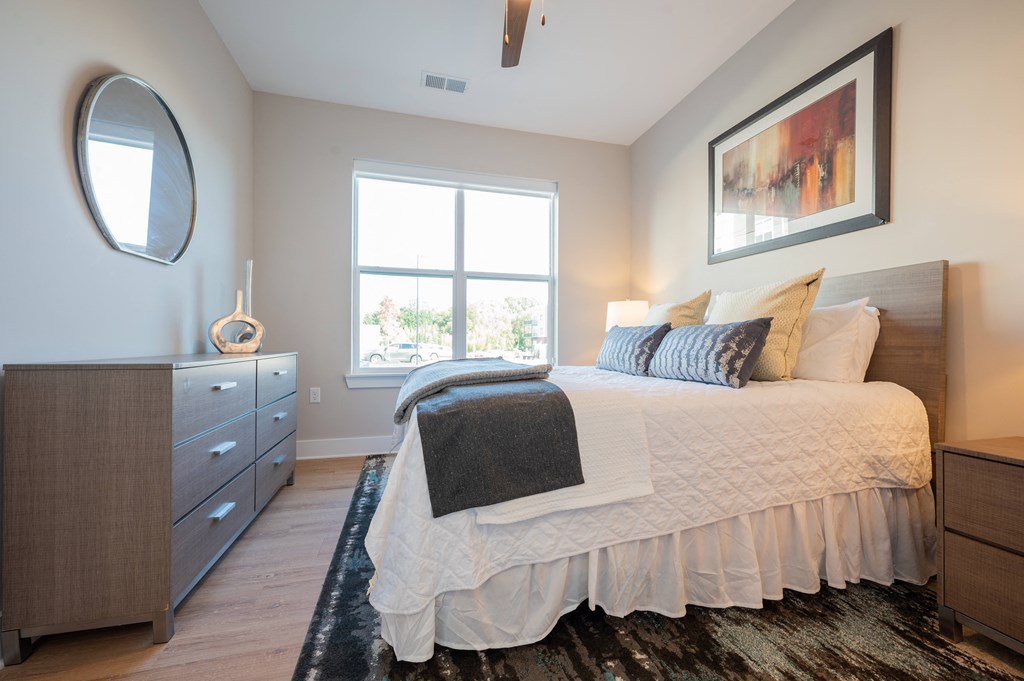 a bedroom with a bed and a dresser and a window at Park View Greer, Greer
