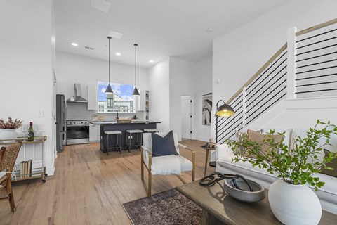 A modern kitchen with a dining table and chairs.
