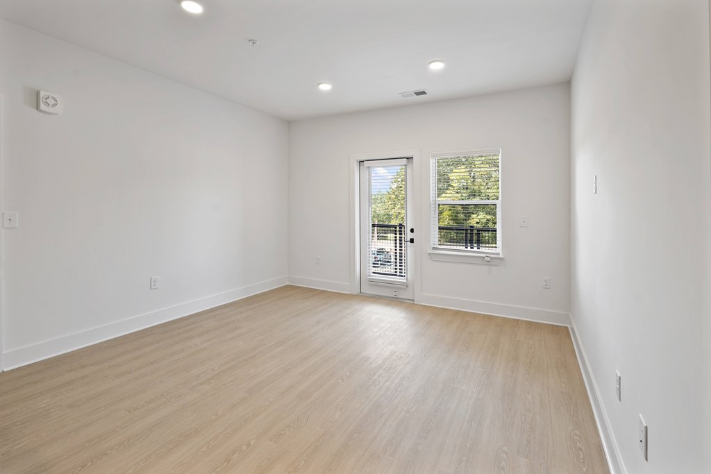 A room with a window and a door.