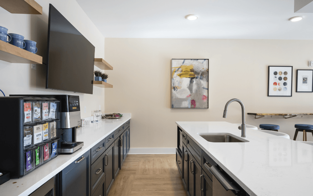 a kitchen with white counter tops and black cabinets at Park View Greer, Greer, SC, 29365