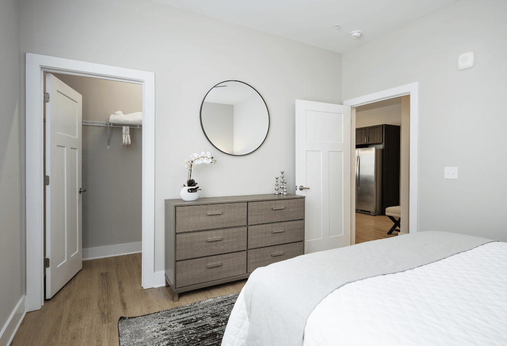 a bedroom with a bed and a dresser with a mirror at Park View Greer, Greer, SC