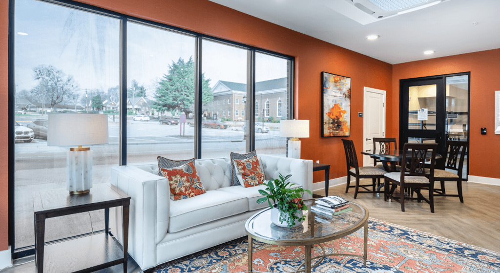 a living room with a white couch and a table at Park View Greer, Greer, South Carolina