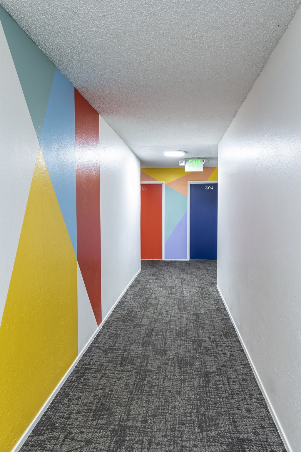 Spacious hallway going to the units.