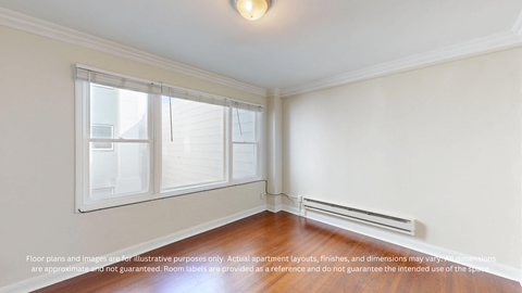 A room with a window and a radiator on the wall.