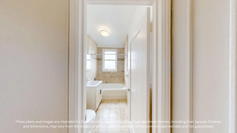 A white bathroom with a toilet, sink, and mirror.