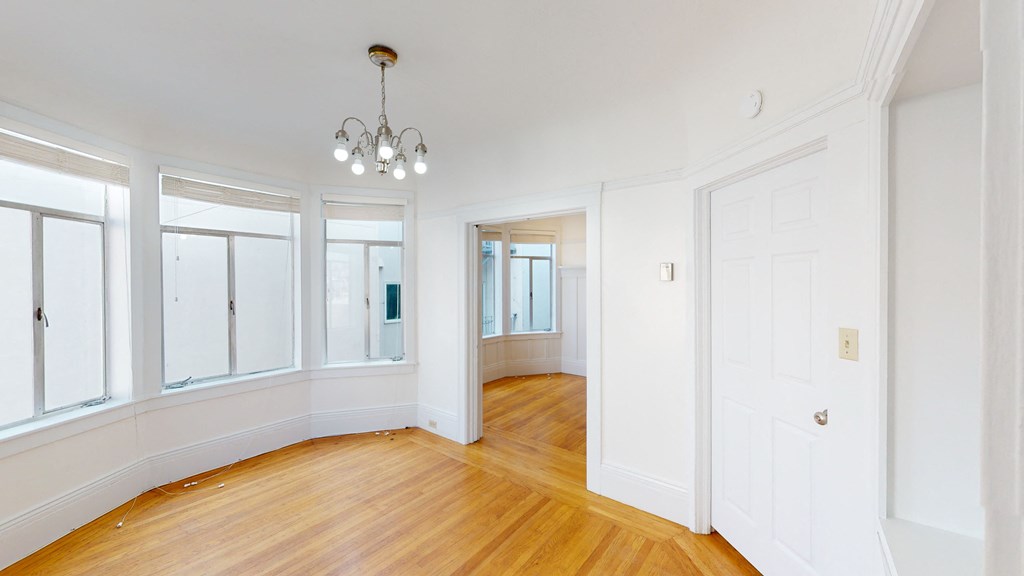 Spacious bedroom with ample lighting and multiple wide windows