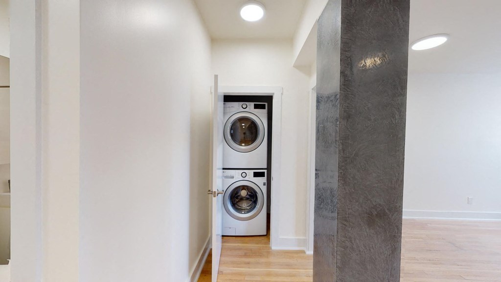 a front loading washer and dryer in a laundry room