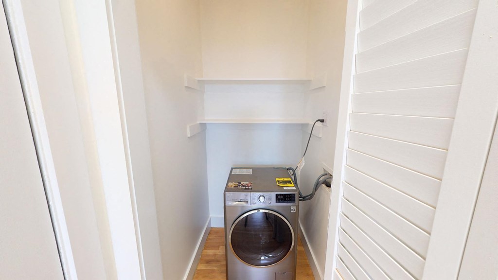 a laundry room with a washing machine in it