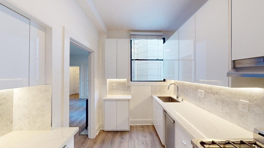 a kitchen with a sink and a window