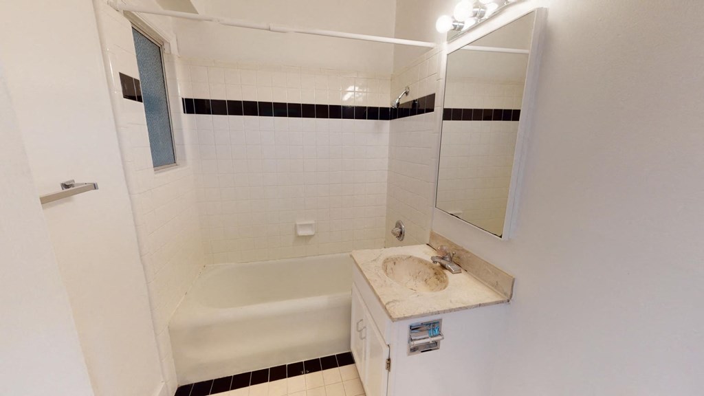 a bathroom with a sink and a bath tub