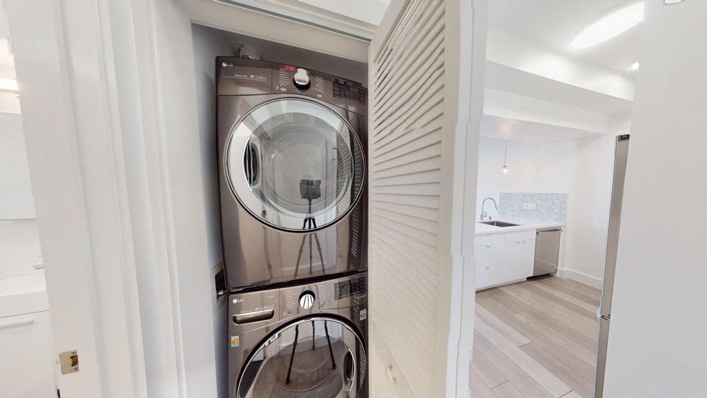 a washer and dryer in a small laundry room