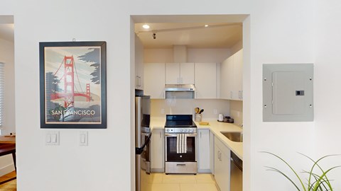 A San Francisco themed artwork hangs above a kitchen counter.