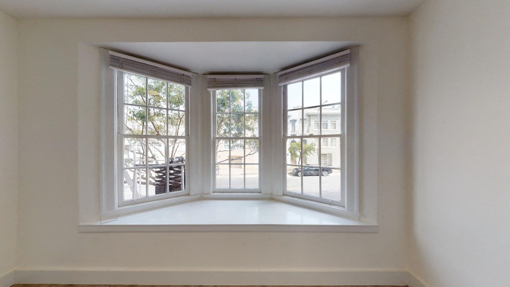 a window sill in a room with three windows
